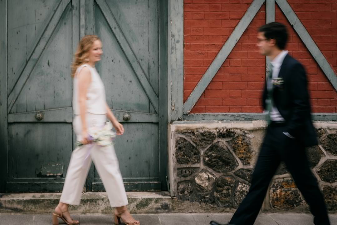 Editorial wedding portrait with modern motion effect, bride walking toward the groom.