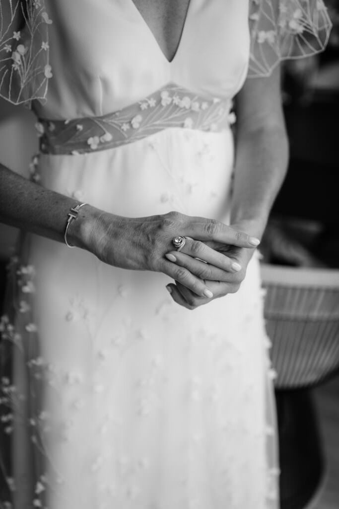 Fine art close-up of elegant bridal dress details and jewellery, captured in refined Parisian style.