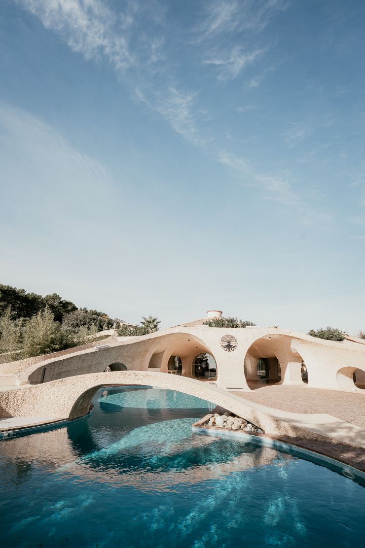 Luxury wedding venue with Mediterranean-inspired architecture and pool, photographed in an elegant editorial style.