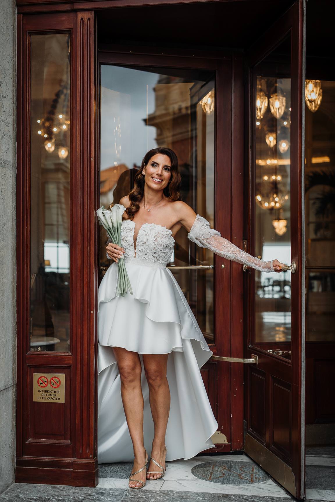 Elegant portrait of a modern bride in Paris wearing a sculptural white wedding dress.