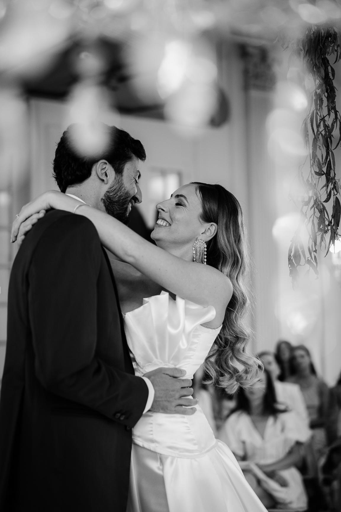 Romantic couple sharing a kiss during their Paris wedding celebration.