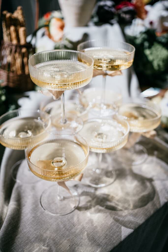 Champagne glasses arranged for a stylish wedding reception celebration.