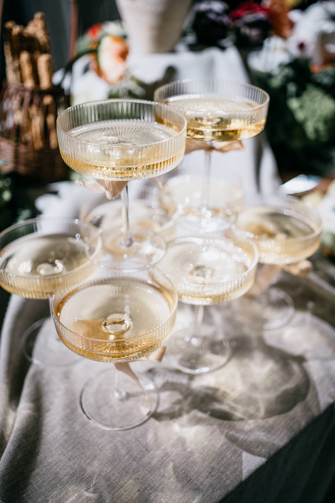 Champagne glasses arranged for a stylish wedding reception celebration.