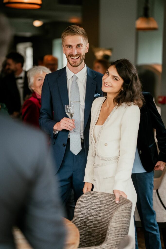 Bride and groom enjoying a relaxed cocktail celebration with their guests near Paris