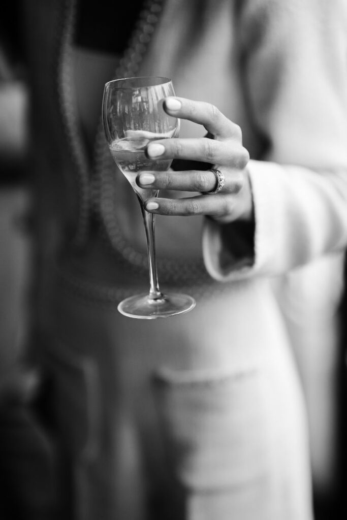 Champagne toast during an intimate wedding cocktail near Paris