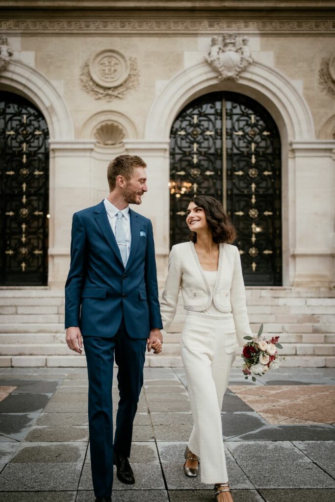Bride and groom walking together at their city hall wedding near Paris