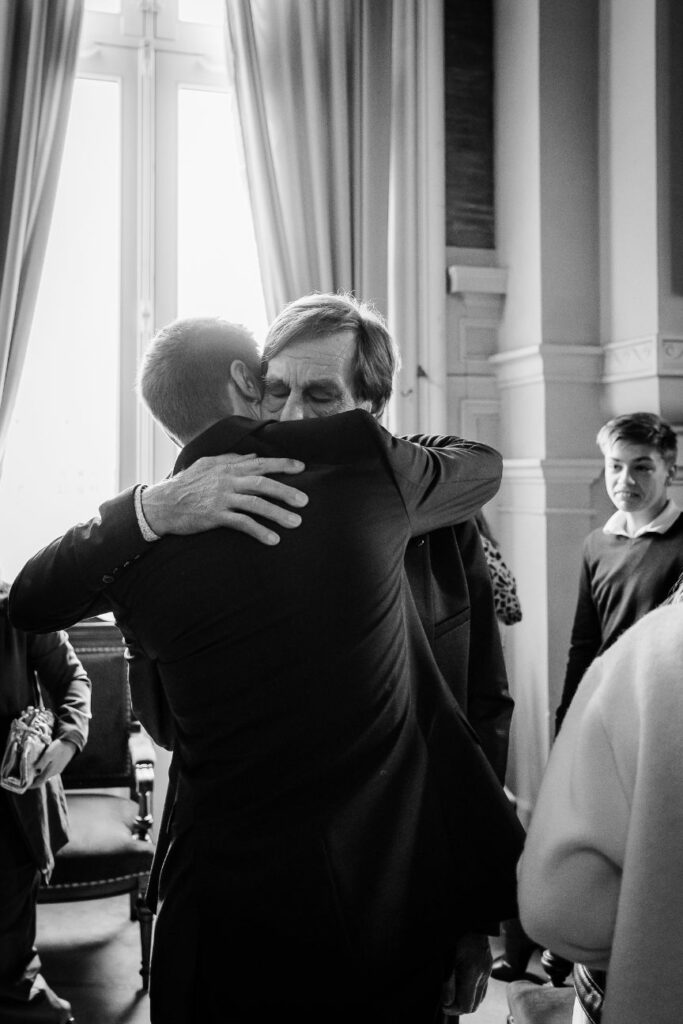 Emotional embrace during a city hall wedding near Paris