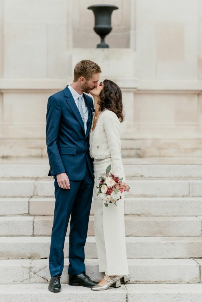 Intimate couple portrait on the steps of a city hall near Paris