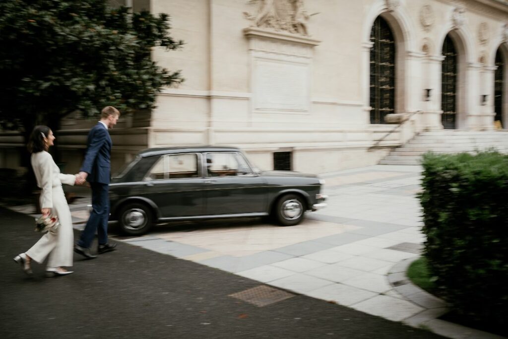 Bride and groom walking together after their city hall wedding near Paris